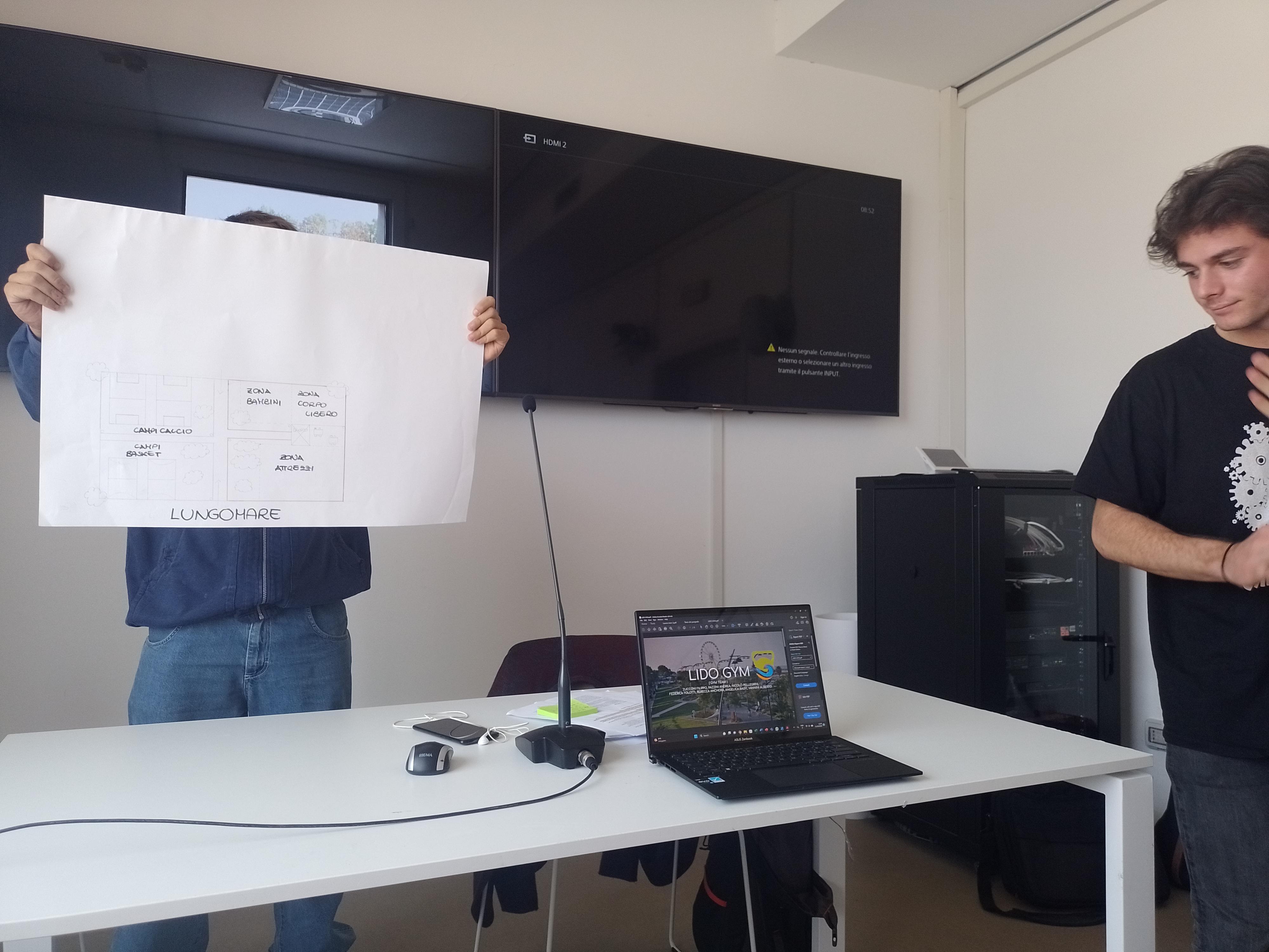 A student is showing a large paper with visions